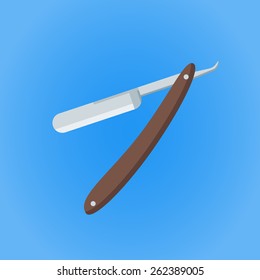 Old razor on blue background