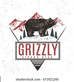 Old retro logo with bear grizzly on mountains background.Vector vintage label