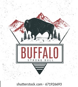 Old retro logo with bull buffalo on mountains background.Vector vintage label