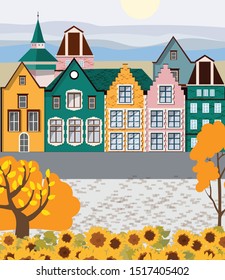 Old retro town with colorful buildings and cobblestone paved road in front. Autumn season. Flat cartoon vector