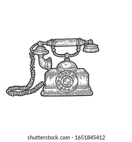 Old rotary dial phone sketch engraving vector illustration. Scratch board style imitation. Black and white hand drawn image.