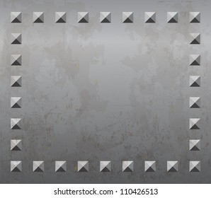 Old rusty metal plate background with rivets