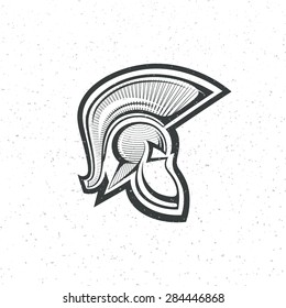 old Spartan, Greek or Roman warrior helmet logo for head protection soldiers with a crest of feathers or horsehair with slits for the eyes , engraving style grunge vector illustration icon