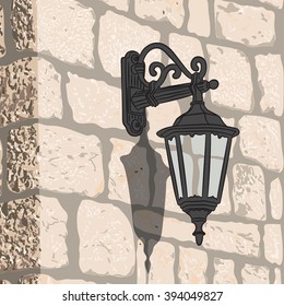 Old stone wall with a lantern. Vector illustration.