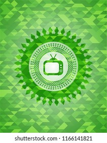 old tv, television icon inside green emblem with mosaic ecological style background