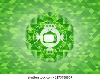 old tv, television icon inside green emblem with triangle mosaic background