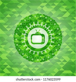 old tv, television icon inside green emblem with mosaic background