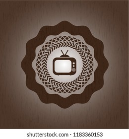 old tv, television icon inside badge with wood background