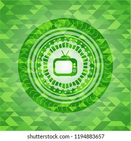 old tv, television icon inside green emblem. Mosaic background