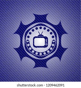 old tv, television icon inside emblem with jean background
