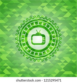 old tv, television icon inside green mosaic emblem