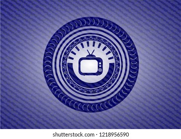 old tv, television icon inside badge with jean texture old tv, television icon inside badge with jean texture