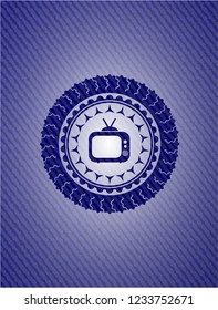 old tv, television icon inside emblem with denim texture