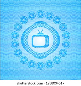 old tv, television icon inside water style emblem.