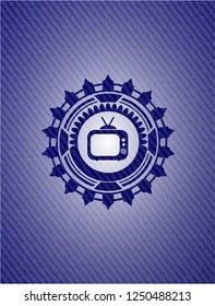 old tv, television icon inside badge with denim texture