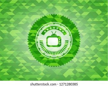old tv, television icon inside green emblem. Mosaic background