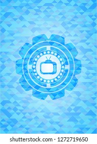 old tv, television icon inside sky blue emblem with triangle mosaic background