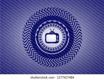 old tv, television icon inside badge with jean texture