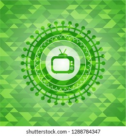 old tv, television icon inside green emblem with mosaic ecological style background