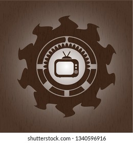 old tv, television icon inside wooden emblem