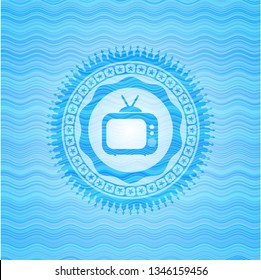 old tv, television icon inside sky blue water wave emblem.