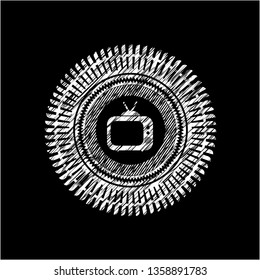 old tv, television icon inside chalkboard emblem on black board