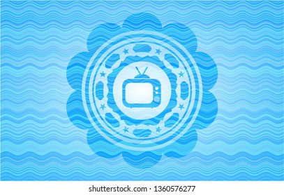 old tv, television icon inside sky blue water wave emblem.