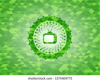 old tv, television icon inside green emblem with triangle mosaic background