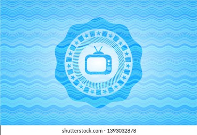 old tv, television icon inside water representation emblem.