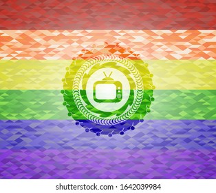 old tv, television icon inside emblem on mosaic background with the colors of the LGBT flag