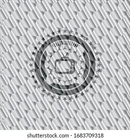 old tv, television icon inside silver badge or emblem. Scales pattern. Vector Illustration. Detailed.