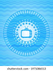 old tv, television icon inside sky blue water emblem. 