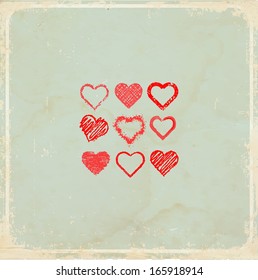 Old vintage background with a set of grunge hearts