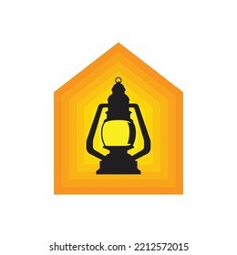Old vintage rusty kerosene black lamp isolated on yellow-orange background. Glass oil lamp. Storm lantern. Object vintage concept.
