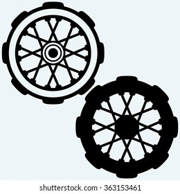 Old wheel motorcycle. Isolated on blue background. Vector silhouettes