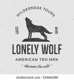 Old wilderness label with wolf and typography elements. Vintage style howling wolf logo. Graphic print design for t-shirts, mugs etc.Hand drawn insignia, rustic design. Vector Letterpress effect.