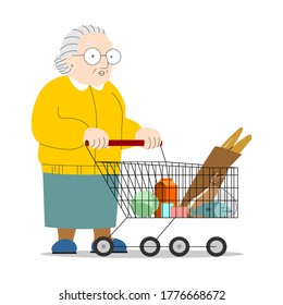 An Old Woman Carries A Grocery Cart. Grandma Walks Around The Store, Buys Groceries, Food. Fair-skinned Elderly Woman With Gray Hair