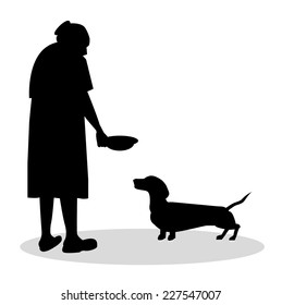 old woman to feed her dachshund