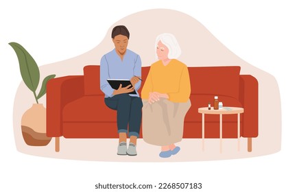 Old woman and home care worker. Nurse explaining her medication.