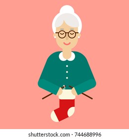 Old woman knits the Christmas sock. Christmas eve concept. Granny character simple flat illustration.