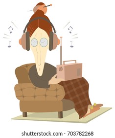 Old woman sits in an armchair and listens the radio