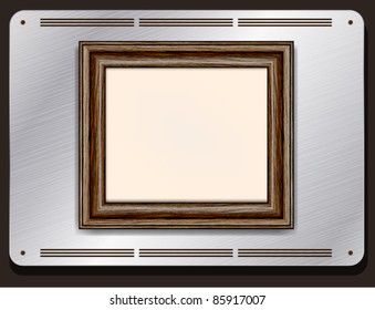 Old wooden frame on the metallic plate