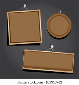 old wooden frames on black wall. vector illustration.