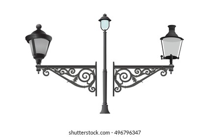 Old wrought electric and gas metal street lamps with decorative details.