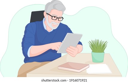 Older Man Works On His Tablet At Home