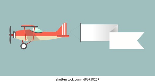 Old-fashioned monoplane with attached long stripe for advertisment