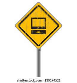 Old-fashioned personal computer on yellow shabby street sign.