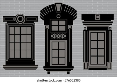 Old-fashioned windows of various designs on a gray brick wall background
