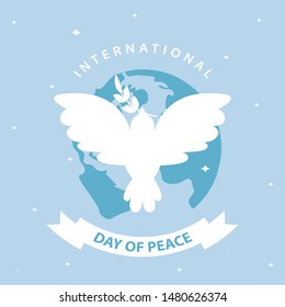 Olive branches and earth, International peace day with doves.