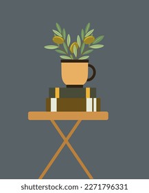 Olivo con copa en una mesa y libros